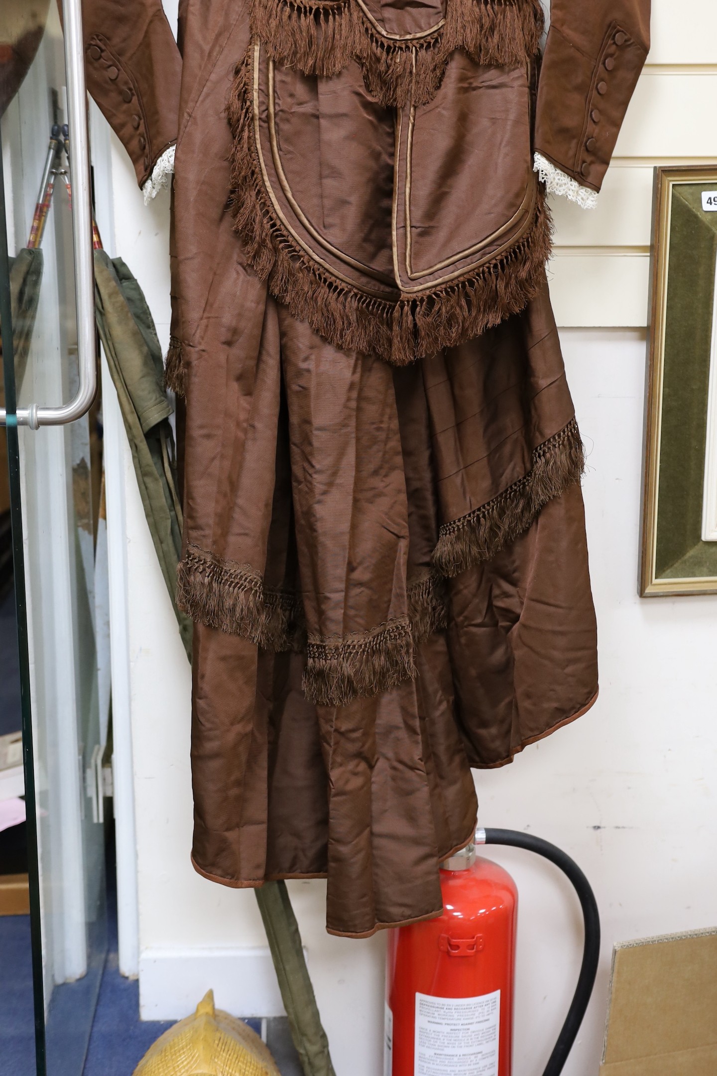 A Victorian brown silk ladies suit skirt and jacket and fronter to the skirt